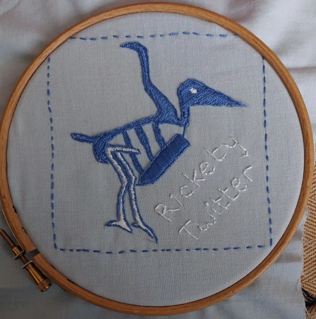 Embroidered skeleton of Twitter bird