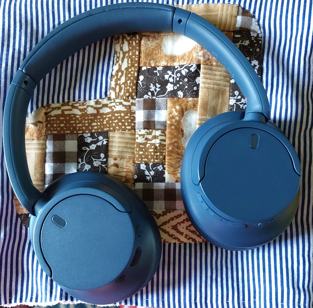picture of headphones on a patchwork background.
