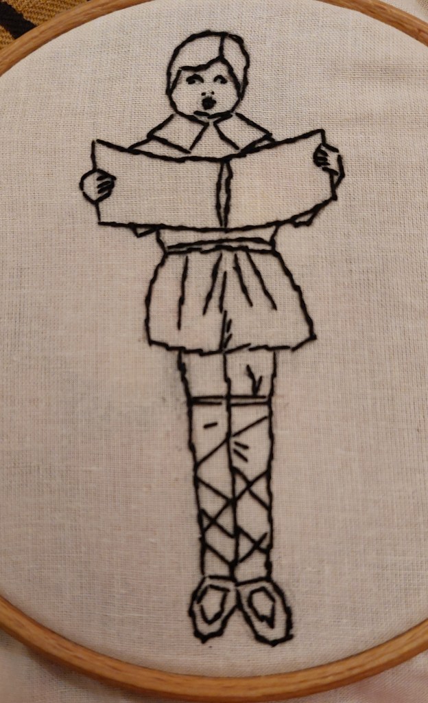 Embroidered copy of child singing from book