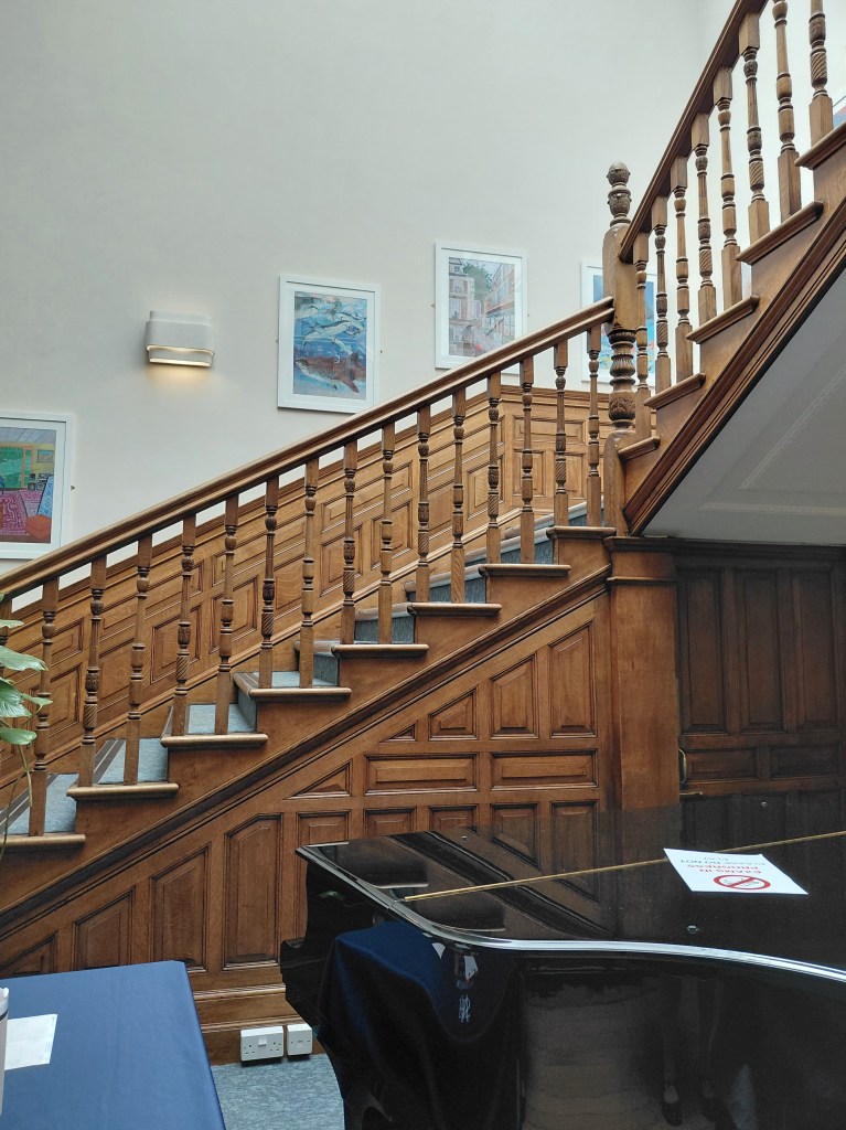 Imposing main staircase (and a rather nice-looking piano)