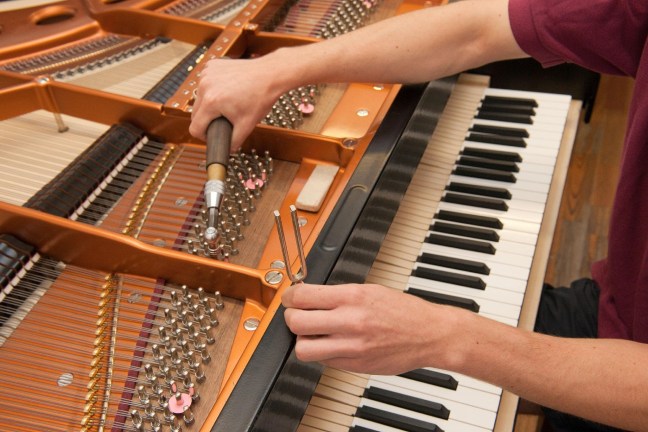 Piano tuner at work
